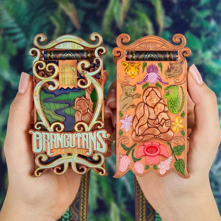 Orangutans of Borneo medal held in hand