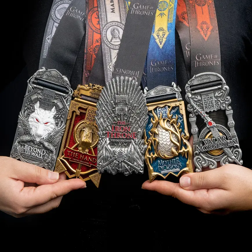 Hand holding the Game of Thrones™ Series Virtual Challenge medal